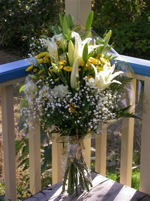 European Hand Tied Bouquet of white oriental lilies, lisianthus, golden button mums, baby's breath