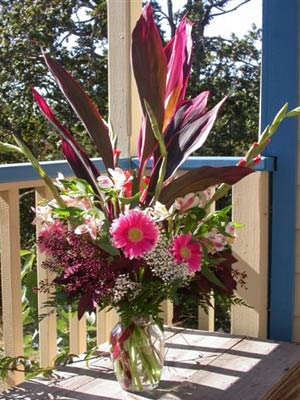European Handtied Bouquet of tropical foliages, gladioli, alstro, gerberas, Joe Pye weed, seeded eucalyptus