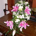 Traditional Cascade Wedding Bouquet of sorbonne lilies, roses, alstromaeria, freesia