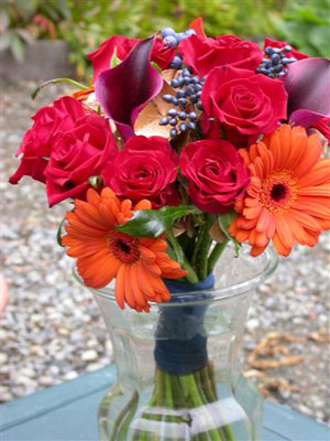 Posy Style Wedding Bouquet of dwarf callas, viburnum, roses, gerberas