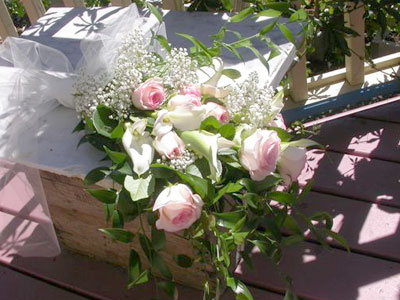 Presentation Style Wedding Bouquet of roses, callas, millionstar gyp, italian ruscus