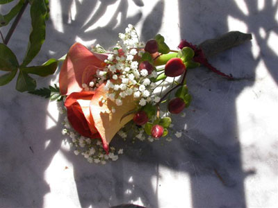 Wedding Boutonniere of leonidas rose, hypericum, millionstar gyp